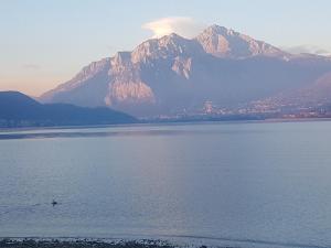 a large body of water with a mountain in the background at Ai Due Vecchi Ulivi in Garlate