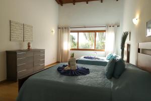 Postel nebo postele na pokoji v ubytování Sybaris Suites & Residences + 37 fotografií