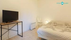 Ένα ή περισσότερα κρεβάτια σε δωμάτιο στο Stay In Evry