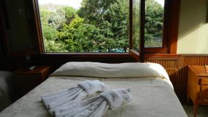 Ένα ή περισσότερα κρεβάτια σε δωμάτιο στο Hotel Norte