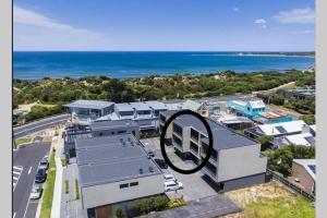 an aerial view of a building with the ocean at Stunning Main Beach Location- Anglesea in Anglesea