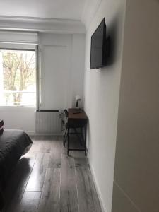 TV a/nebo společenská místnost v ubytování AMARA PIO XII PARKING 15E night WIFI TERRACE