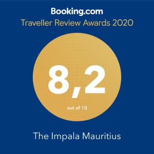 蒙舒瓦西The Impala Mauritius holiday and leisure flat Mon Choisy -Trou aux biches的黄圈,带文字旅行审查奖和黑猩猩
