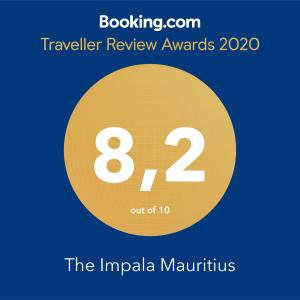 un cercle jaune avec les récompenses textuelles de voyage et la impala marinirus dans l'établissement The Impala Mauritius, à Trou aux Biches