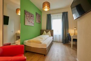 Tempat tidur dalam kamar di Hotel Ambassador