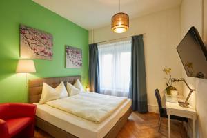 Tempat tidur dalam kamar di Hotel Ambassador