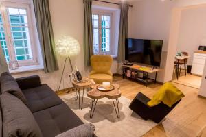 Televízia a/alebo spoločenská miestnosť v ubytovaní Charming 45m2 Apartment in Heart of Graz