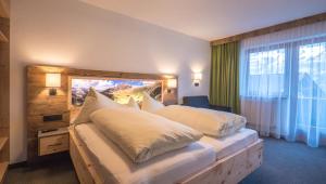 Postel nebo postele na pokoji v ubytování Central Hotel & Apart mit Landhaus Central