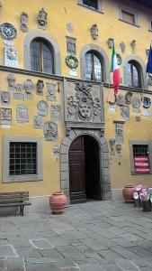 a building with plates on the side of it at Casotti in Cutigliano
