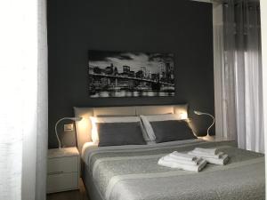 Łóżko lub łóżka w pokoju w obiekcie La Maggiolina camere La Spezia