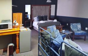 TV a/nebo společenská místnost v ubytování Rustique Paris Guest House