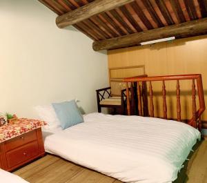Postel nebo postele na pokoji v ubytování XQ B&B