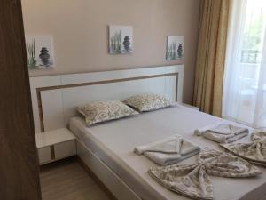Postel nebo postele na pokoji v ubytování Guest rooms Luxor