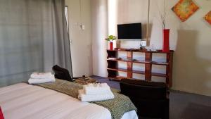 Postel nebo postele na pokoji v ubytování Rustique Paris Guest House
