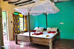 Letto o letti in una camera di Sagando Bungalows Zanzibar