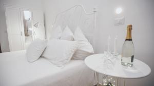 A bed or beds in a room at Cortile Oliva