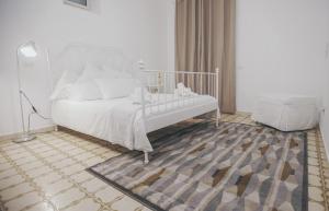 A bed or beds in a room at Cortile Oliva