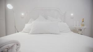 A bed or beds in a room at Cortile Oliva