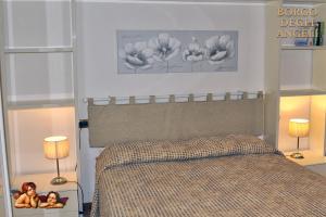 Lova arba lovos apgyvendinimo įstaigoje Borgo degli Angeli Arcola