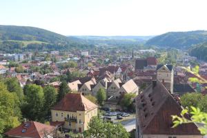 a view of a town with buildings and trees at Kuschelige Ferienwohnung nahe Kronach in Kronach