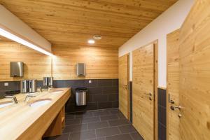 a bathroom with two sinks and a shower at Guesthouse Lajnar in Zgornja Sorica +141 photos