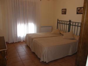 Posteľ alebo postele v izbe v ubytovaní Casa Rural Alonso Quijano + 19 fotografií