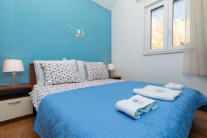 Posteľ alebo postele v izbe v ubytovaní Apartman Monika