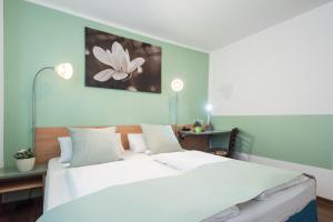 Postel nebo postele na pokoji v ubytování Residenz Hotel Wuppertal