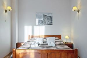Postel nebo postele na pokoji v ubytování Hotel Łokietek