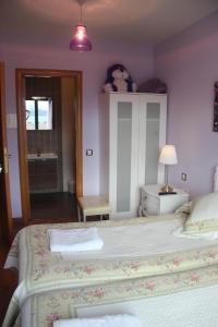 Postel nebo postele na pokoji v ubytování Hostal Maury