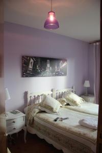 Postel nebo postele na pokoji v ubytování Hostal Maury