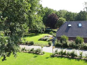 an aerial view of a garden with a house at De Hammerhoeve in Dalfsen +18 photos