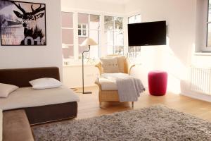 Telewizja i/lub zestaw kina domowego w obiekcie Ferienhaus Alpennest