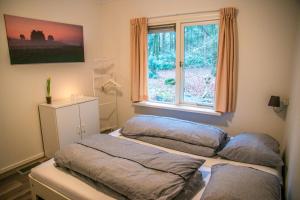 Кровать или кровати в номере Vakantiehuis 't Musje