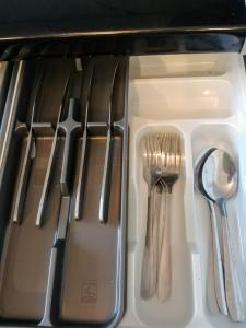 a group of utensils sitting in a drawer at Apatrament Jagielońska in Legnica