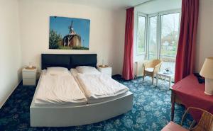 Postel nebo postele na pokoji v ubytování Gästehaus Bögemann