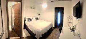 Postel nebo postele na pokoji v ubytování Apartments & Rooms Formenti