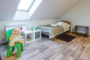 Postel nebo postele na pokoji v ubytování Hotel Łokietek