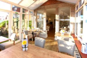 a dining room with a table and chairs at The Castleton in Swanage