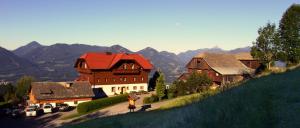 a group of buildings with mountains in the background at Pension Bauernhof Stanahof in Fresach