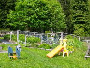 a playground with a slide in the grass at Haus Walpurga in Schierke