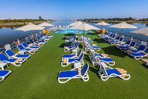 a bunch of chairs and umbrellas on a lawn at MS Chateau Lafayette Nile Cruise - 4 nights from Luxor each Monday and 3 nights from Aswan each Friday in Luxor