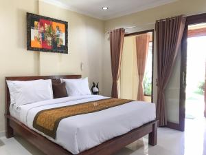 Katil atau katil-katil dalam bilik di Villa Dira Ubud
