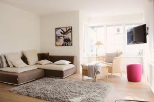 a living room with a couch and a table at Ferienhaus Alpennest in Radstadt