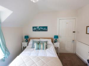 Ένα ή περισσότερα κρεβάτια σε δωμάτιο στο The Ness Guest House +11 φωτογραφίες