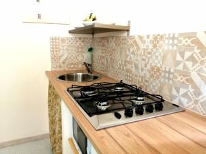 A kitchen or kitchenette at DUCEZIO rooms