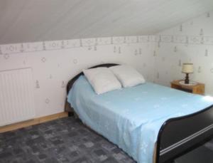 Postel nebo postele na pokoji v ubytování la maison de pierre