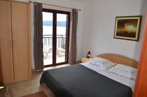 Posteľ alebo postele v izbe v ubytovaní Apartments Vucak