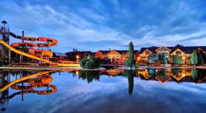 a water park with a slide in the water at Luxury Apartment in Bešeňová