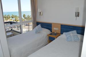 Posteľ alebo postele v izbe v ubytovaní Aloha Playa Primera